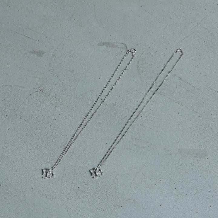 Cross logo necklace - white silver